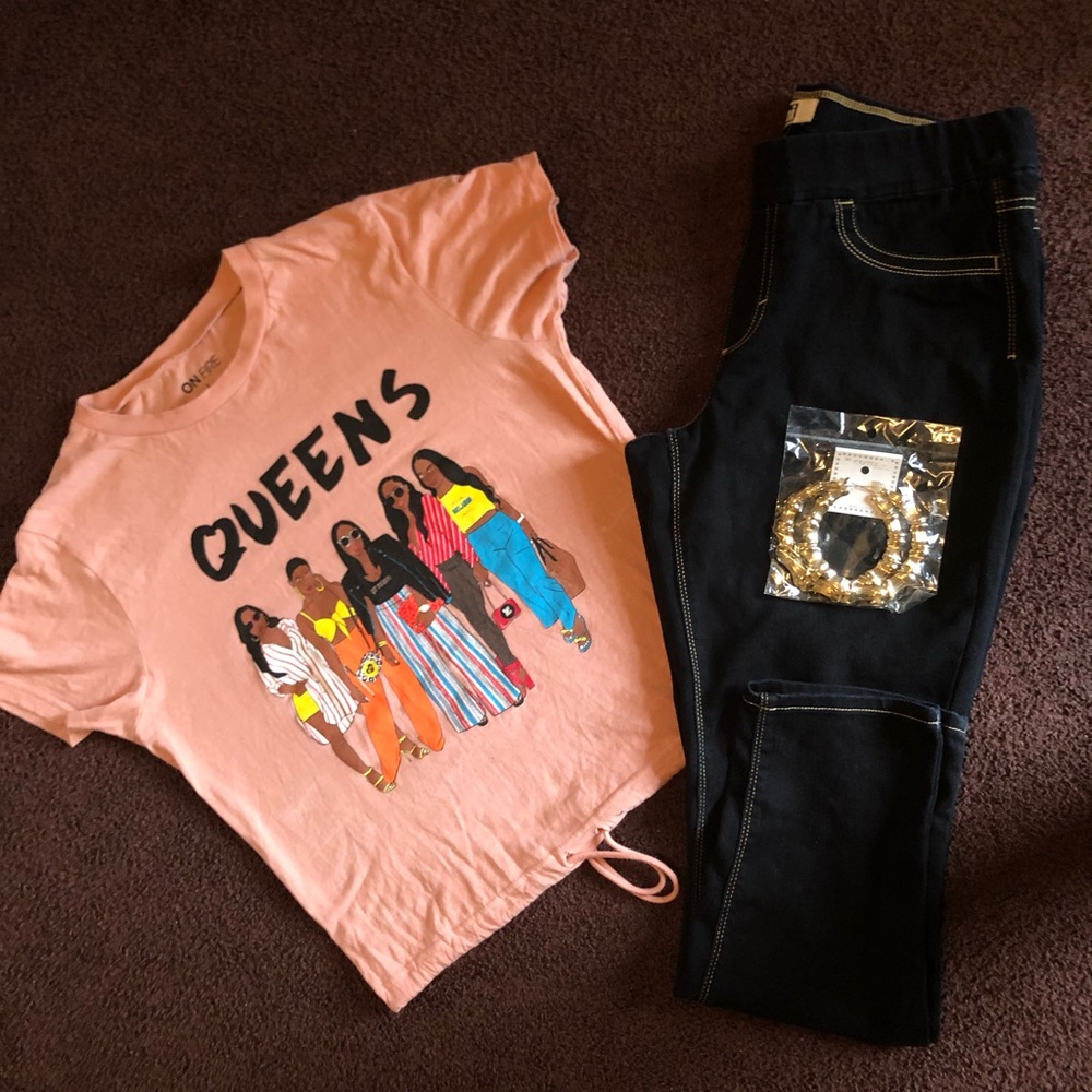 T-shirt, denim jeans, and earrings
